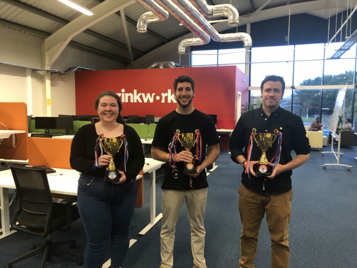 Three employees celebrating their victory at Zinkworks Hackathon